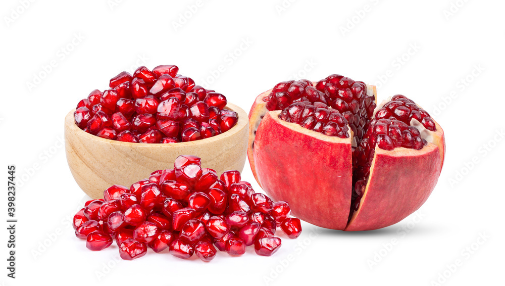 Pomegranate seeds in wood bowl on white background Pomegranate seeds in wood bowl on white background
