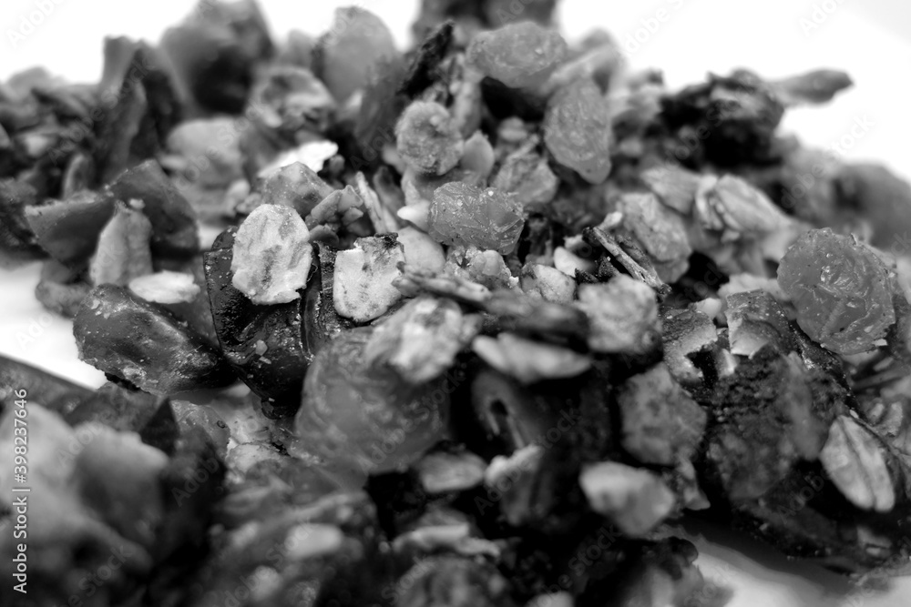 Tasty granola on white with blur effect in black and white. Tasty granola on white with blur effect in black and white.