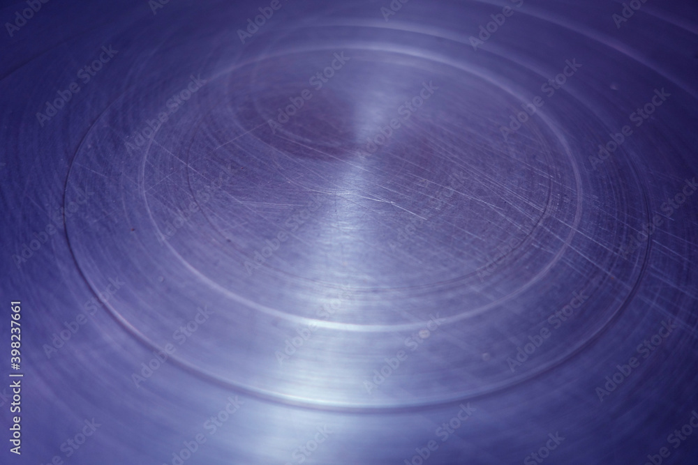 Obraz premium Scratched blue toned round metal surface