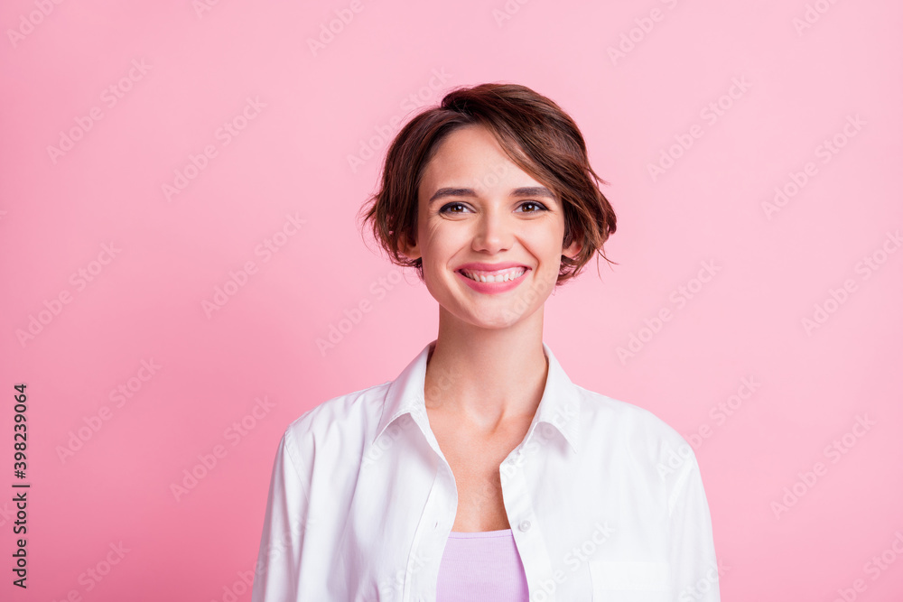 Photo portrait of happy smiling female student wearing casual white shirt isolated on pink pastel color background Photo portrait of happy smiling female student wearing casual white shirt isolated on pink pastel color background