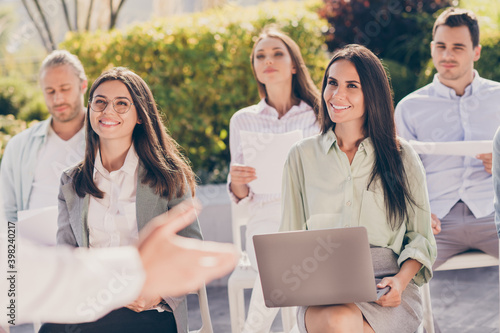Portrait of nice cheerful smart trendy entrepreneurs attending conference listening speaker finance management on fresh air park outside outdoor