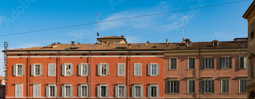 Orange apartments with white shutters on square Piazza Roma. Modena, Italy, Panorama view