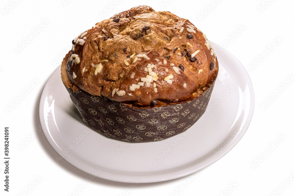 Panettone - Italian Christmas cake from Milan, prepared to celebrate Christmas and New Year, on plate, isolated on white Panettone - Italian Christmas cake from Milan, prepared to celebrate Christmas and New Year, on plate, isolated on white