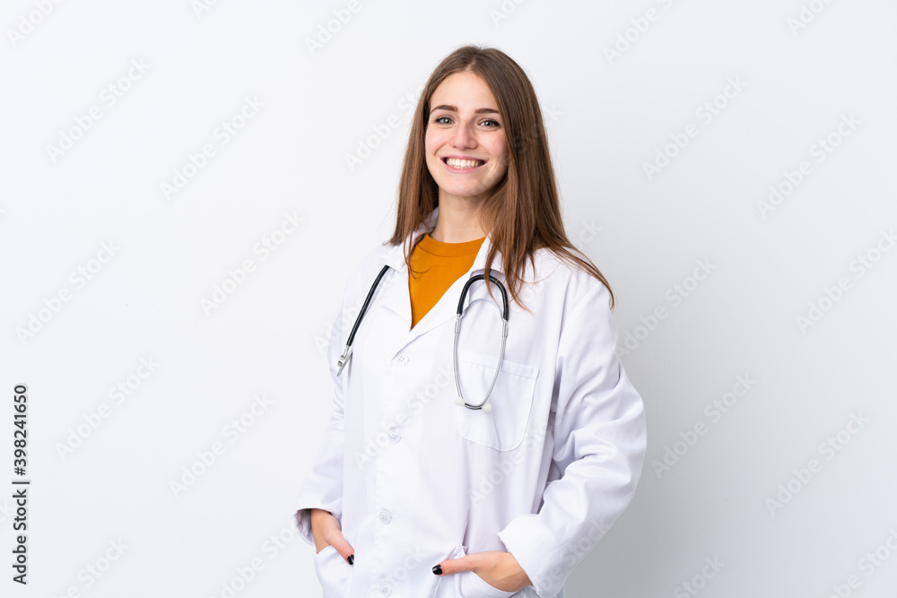 Young woman over isolated background wearing a doctor gown and with stethoscope