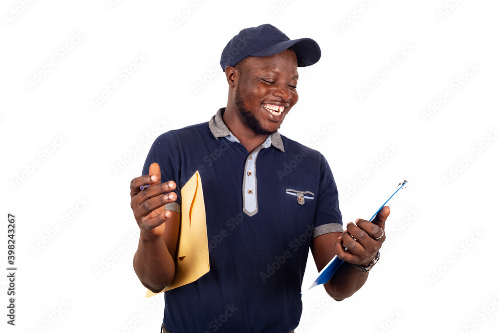 young delivery man reading document on clipboard
