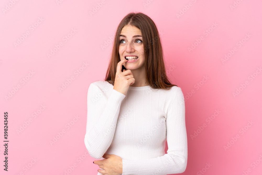 Young woman over isolated pink background nervous and scared Young woman over isolated pink background nervous and scared