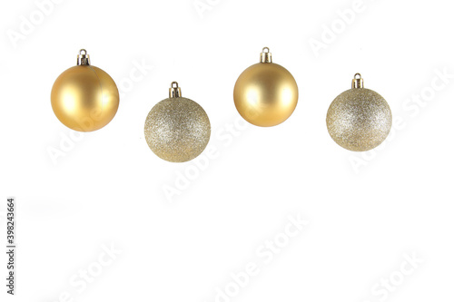 four golden christmas balls isolated on white background. Christmas decoration concept