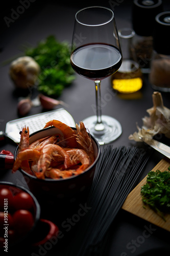 black shrimp table with wine noodles and spices