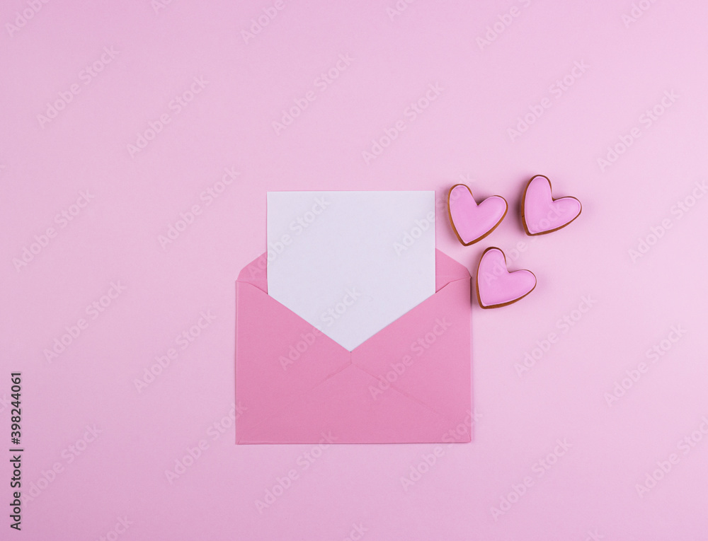 Envelope with a red heart for Valentine's Day on a pink background