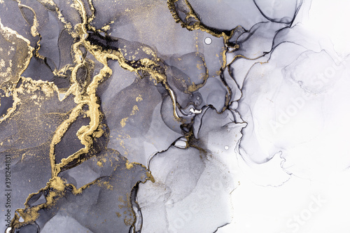 Modern hand painted artwork of abstract transparent alcohol ink background. A...