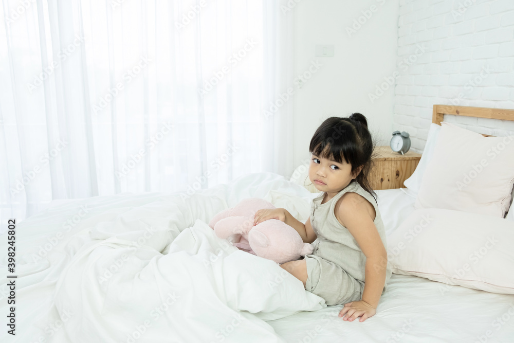 Adorable happy Asian toddler girl just wake up and still sleepy and upset Adorable happy Asian toddler girl just wake up and still sleepy and upset