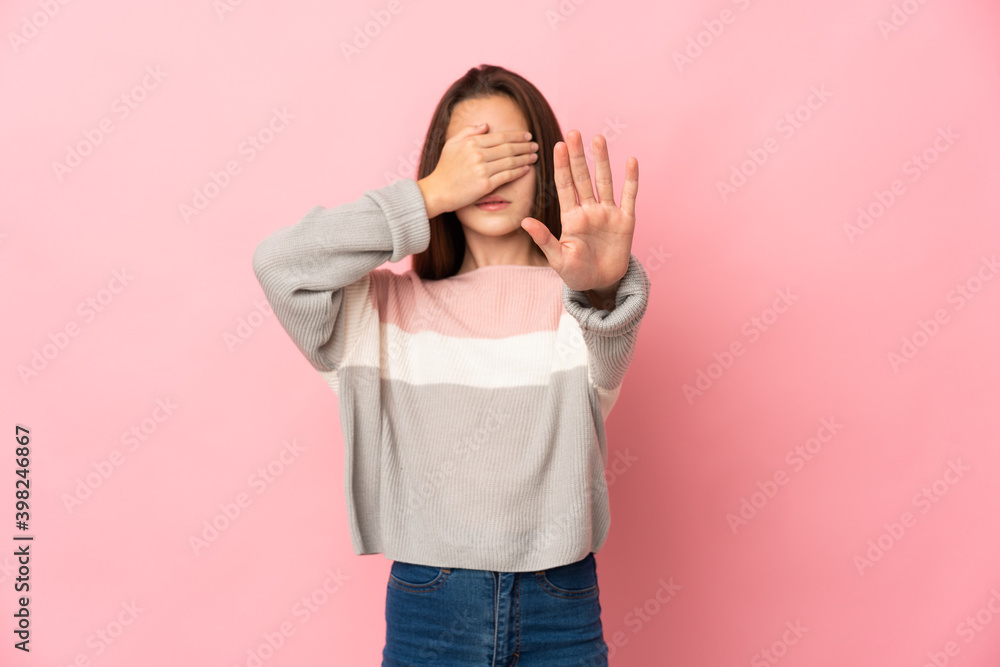 Little girl isolated on pink background making stop gesture and covering face Little girl isolated on pink background making stop gesture and covering face