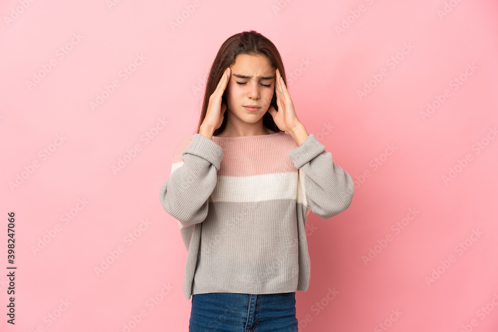 Little girl isolated on pink background with headache Little girl isolated on pink background with headache