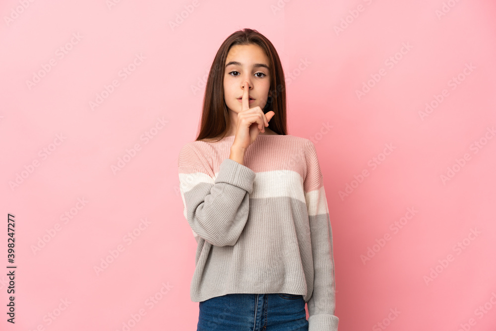 Little girl isolated on pink background showing a sign of silence gesture putting finger in mouth Little girl isolated on pink background showing a sign of silence gesture putting finger in mouth