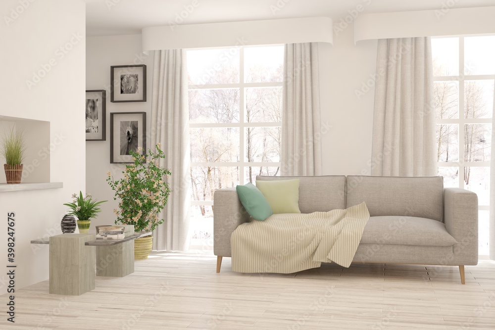 Naklejka premium White living room with sofa and winter landscape in window. Scandinavian interior design. 3D illustration