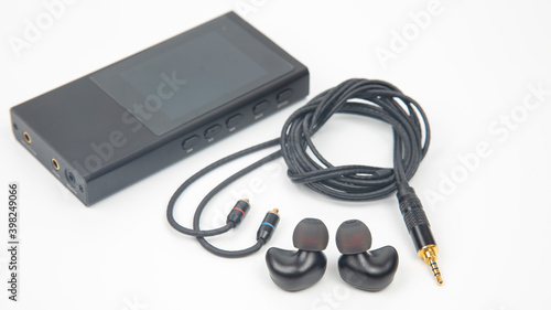 In-ear headphones for Hi-Fi music player. Audio sound and modern equipment for music lovers and audiophiles