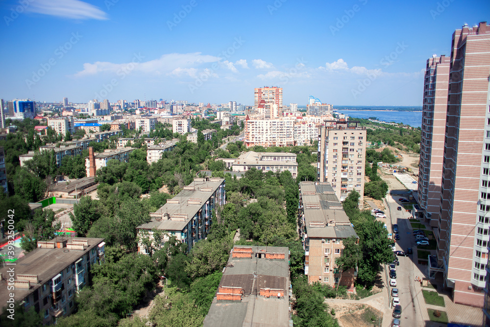 View of the city from above. A metropolitan area with edite high-rises and five-story old buildings