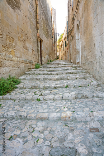 Small street with cobblestone stairs in Unesco town Matera, Italy
