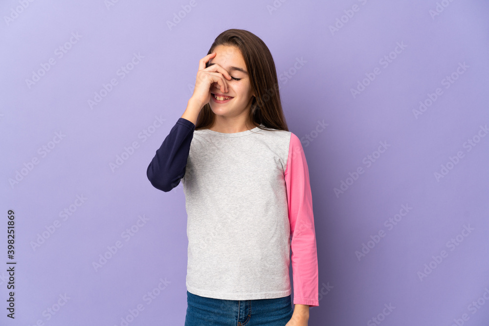 Little girl isolated on purple background laughing Little girl isolated on purple background laughing