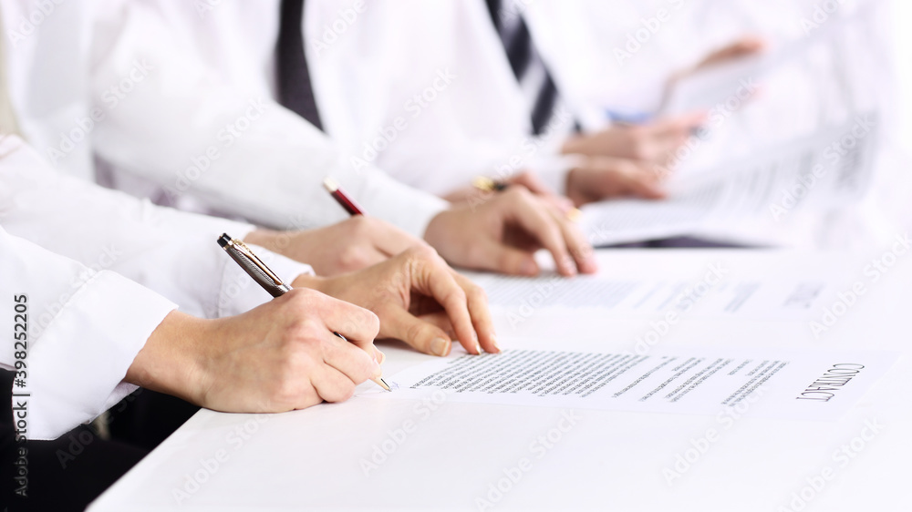 close up. group of employees studying business documents. close up. group of employees studying business documents.