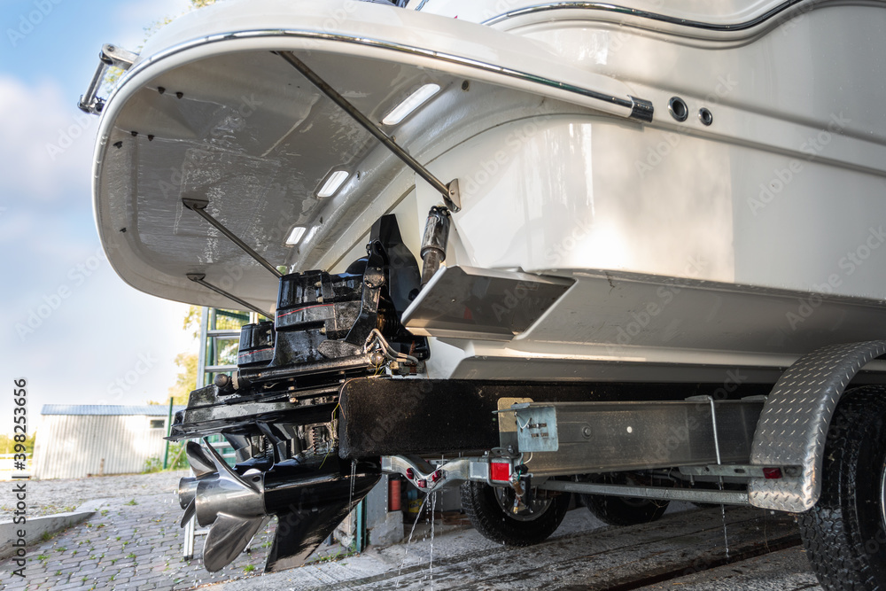 custom made wallpaper toronto digitalBig luxury cabin motorboat cruiser yacht engine at trailer ramp from storage boat hangar garage. Ship service, cleaning, repair or maintenance concept. Luxury fishing leisure recreation lifestyle