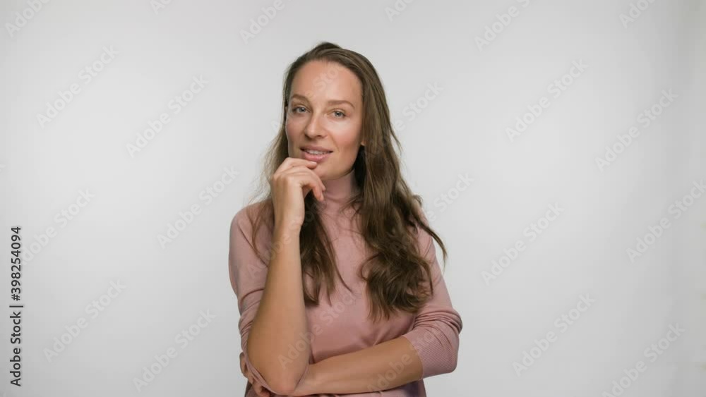 portrait of a flirting and smiling woman in a pink blouse portrait of a flirting and smiling woman in a pink blouse