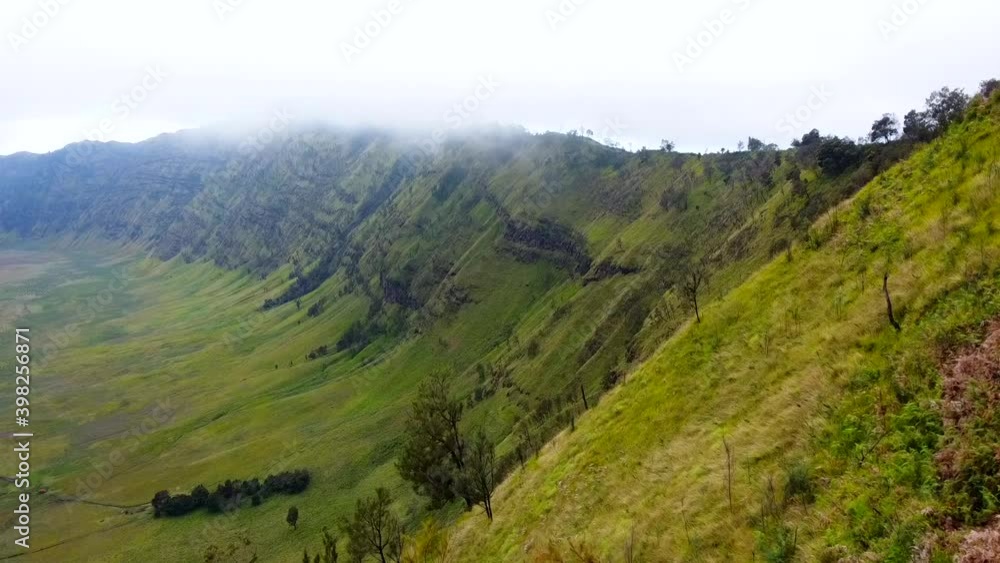 Green grass field with cloud in the morning. Landscape view of Bromo Savannah
Green grass field with cloud in the morning. Landscape view of Bromo Savannah