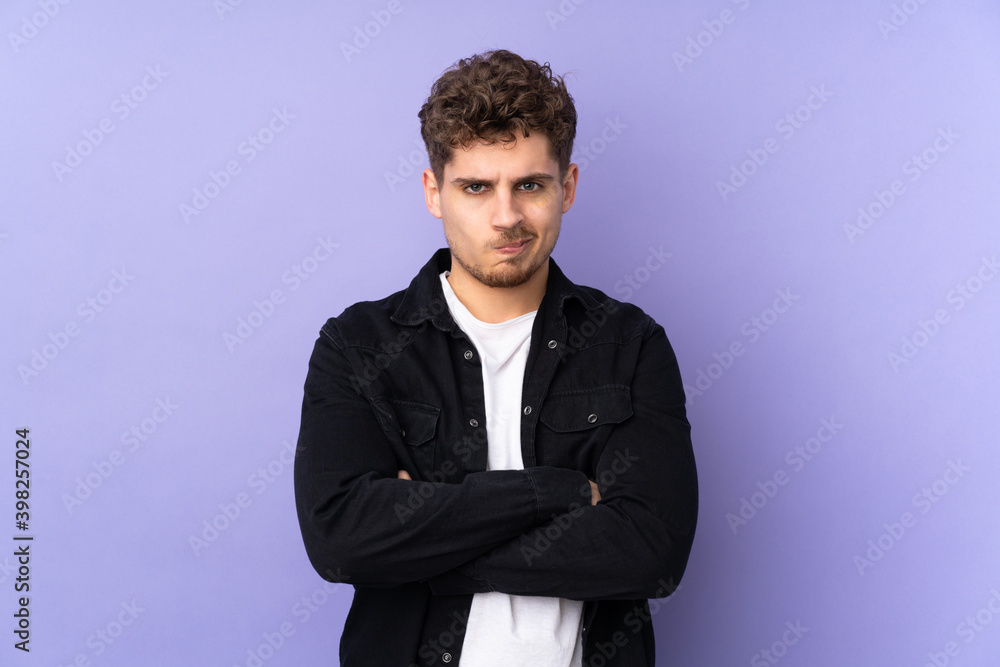 Caucasian man isolated on purple background with unhappy expression Caucasian man isolated on purple background with unhappy expression