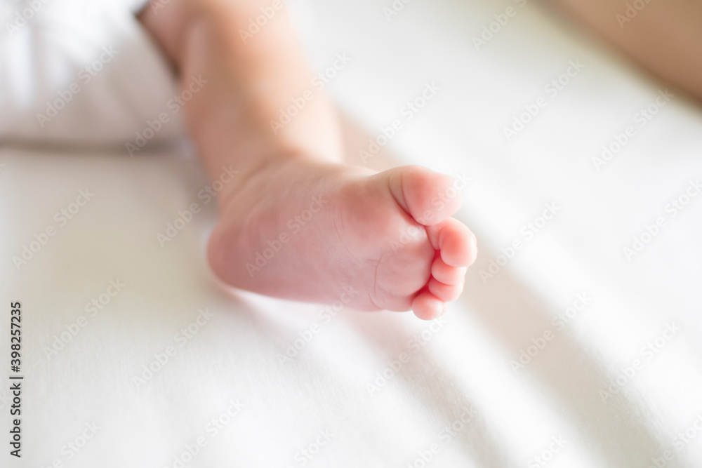 Baby bare foot on bed Baby bare foot on bed