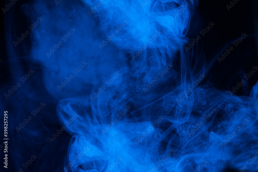 Obraz premium Blue steam on a black background.