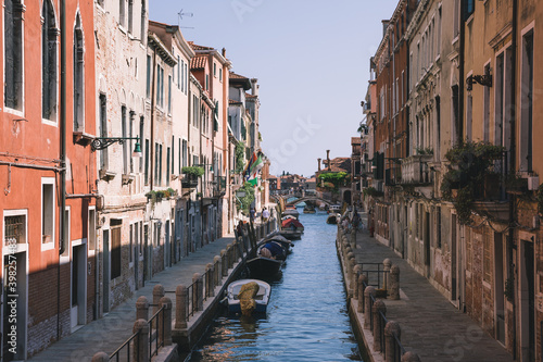 Panoramic view of Venice narrow canal with historical buildings and boat © TravelFlow