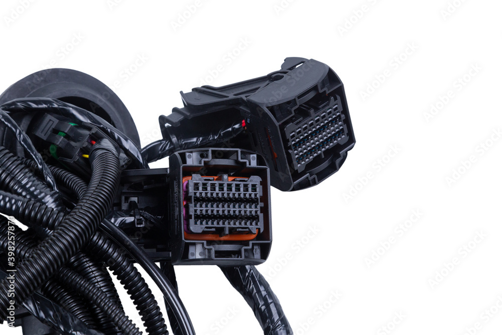 A cable made of tangled wires with black connectors in the car's electrical wiring A cable made of tangled wires with black connectors in the car's electrical wiring