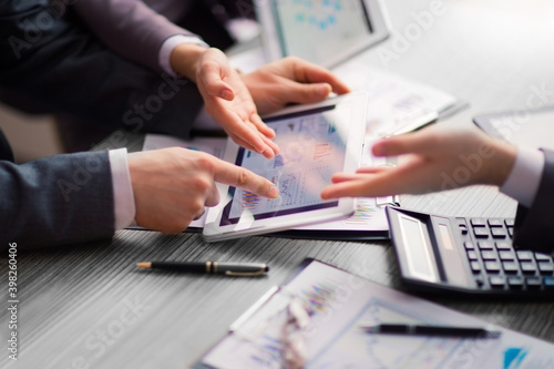 close up. business colleagues discussing financial documents.