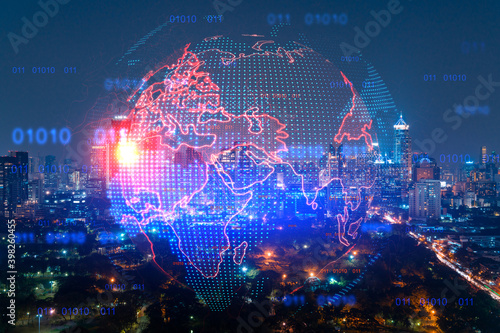 Hologram of Earth planet map on night panoramic cityscape of Bangkok, Asia. The concept of international companies. Multi Exposure. © VideoFlow