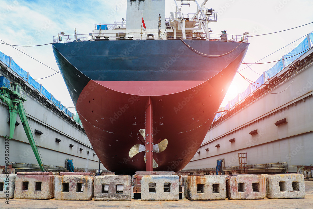 Stern ship moored on floating dock yard, Ship under repair and