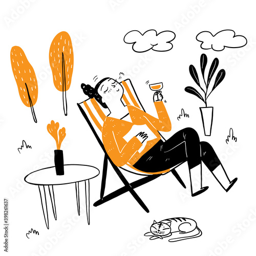 Pretty woman sitting in a deck chair drinking fancy cocktail