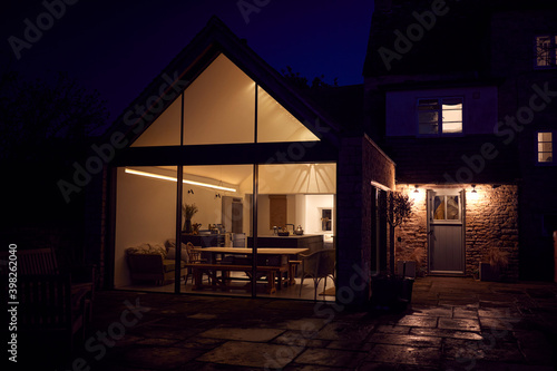 Exterior View Of Beautiful Kitchen Extension At Night photo