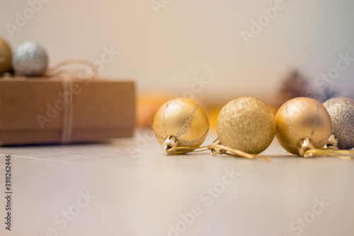 Christmas present, decoration balls and cones laying on the table. Xmas and new year background. Winter holidays concept.