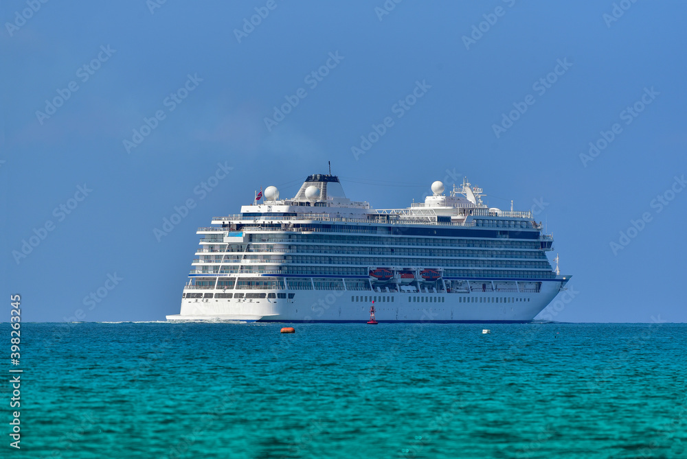 Cruise Ship at harbor, Aaeal view of beautiful large white ship at blue skl luxury cruise floating line and Stern ship.