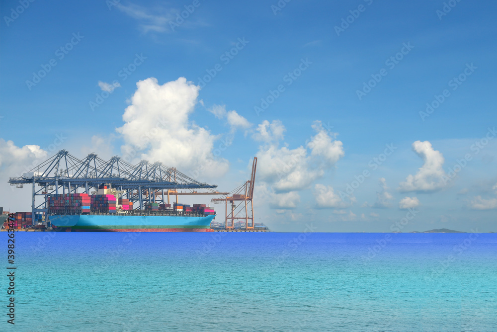 Container ship Mooring in port, Logistics import export background of container Cargo ship in seaport on blue sky, fright Transportation.