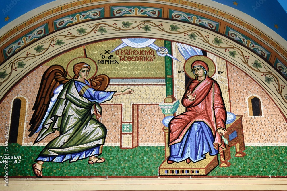 Beautiful mosaic showing  the Annunciation to the Virgin Mary outside of  Christian orthodox church - Athens, Greece, March 12 2020.