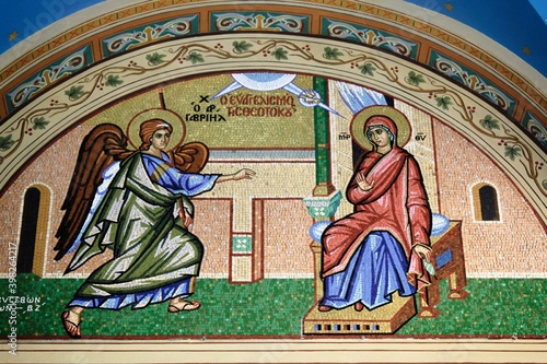 Beautiful mosaic showing the Annunciation to the Virgin Mary outside of Christian orthodox church - Athens, Greece, March 12 2020.