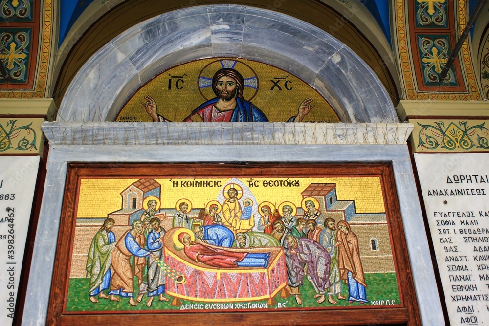 Beautiful mosaic showing the Dormition of the Virgin Mary outside of a Christian orthodox church - Athens, Greece, March 12 2020.