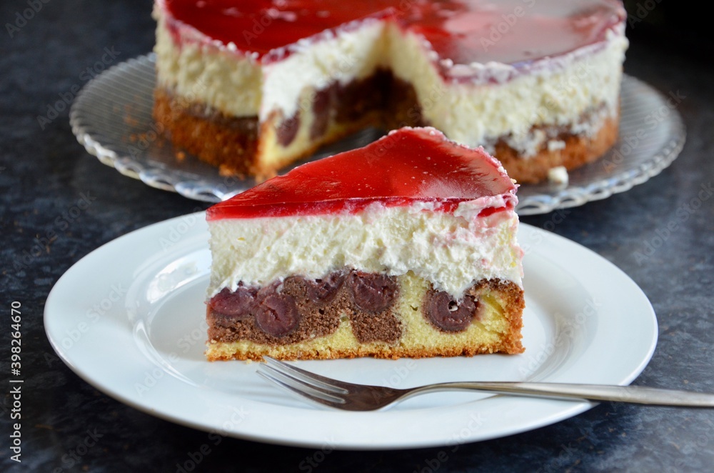 Homemade snow white cake (in other parts of the country called Little red riding hood cake) with chocolate, cherries and cream filling, red cherry juice glaze,a sweet speciality in Germany and Austria Homemade snow white cake (in other parts of the country called Little red riding hood cake) with chocolate, cherries and cream filling, red cherry juice glaze,a sweet speciality in Germany and Austria