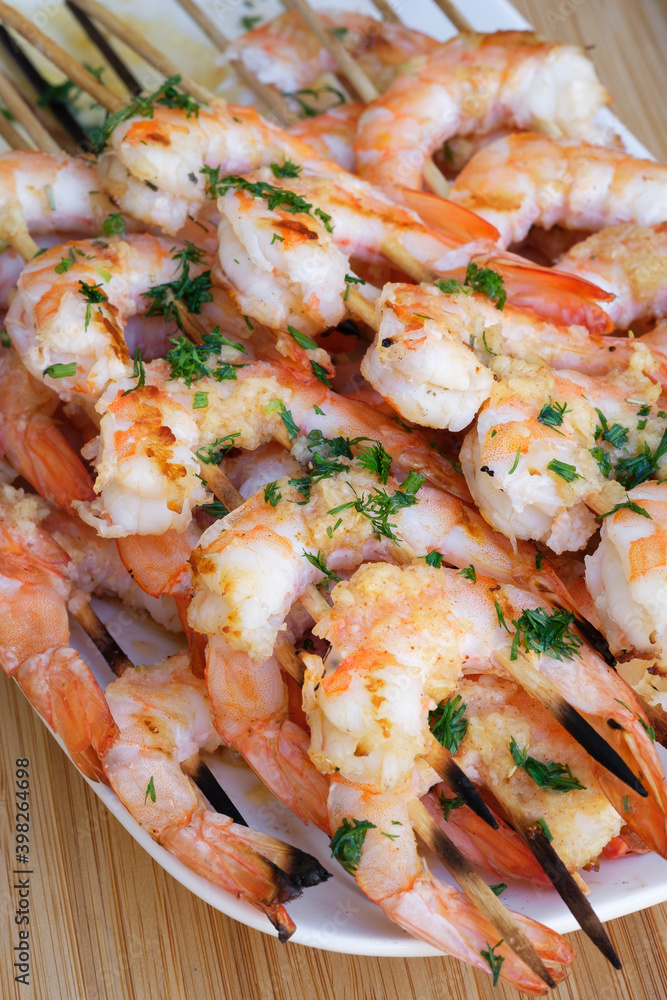 Grilled king prawns on skewers. Festive menu Grilled king prawns on skewers. Festive menu
