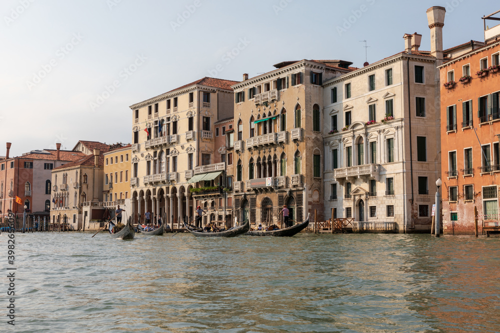 Panoramic view of Grand Canal (Canal Grande) with active traffic gondolas