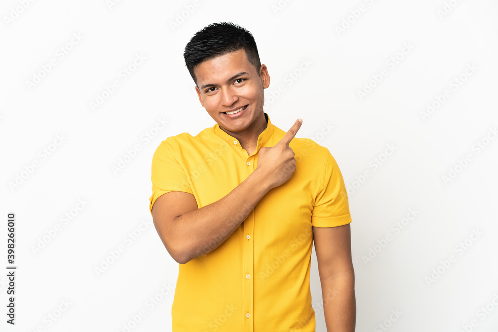 Young Ecuadorian man isolated on white background pointing to the side to present a product Young Ecuadorian man isolated on white background pointing to the side to present a product