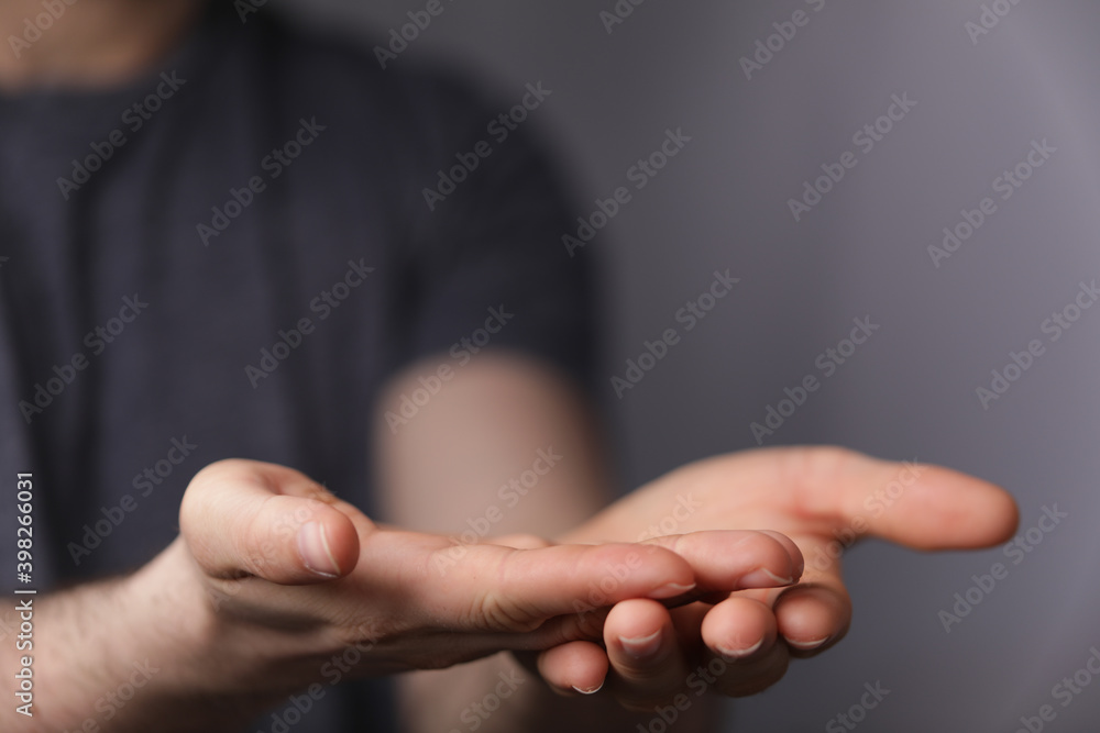 A man without head holding something without theme. A man without head holding something without theme.