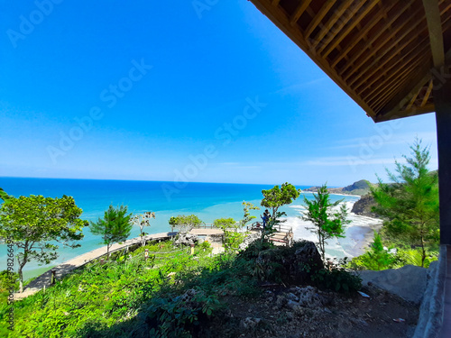 Wallpaper Mural Surumanis beach, a beautiful blue beach with black sand and surrounded by hills Torontodigital.ca