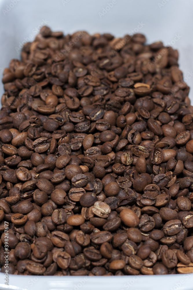 Perspective view of medium roasted coffee beans. Coffee shop. Freshly roasted coffee beans. Perspective view of medium roasted coffee beans. Coffee shop. Freshly roasted coffee beans.